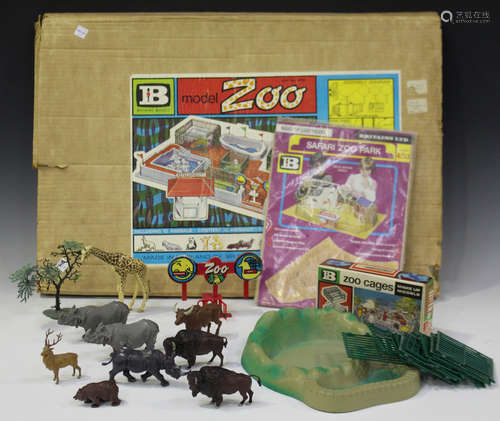 A collection of Britains plastic zoo figures and accessories, including various wild animals, fences