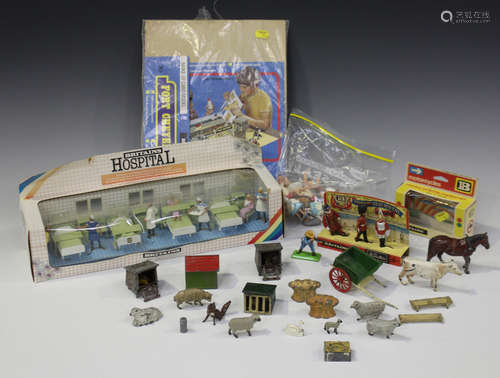 A collection of Britains figures and accessories, including a No. 7857 Hospital ward with day/