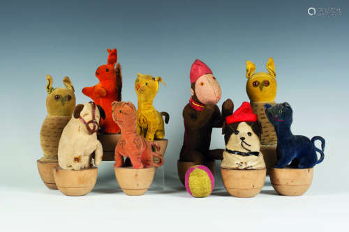 A set of nine early 20th century German soft toy skittles, comprising a brown felt seated monkey