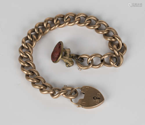 A gold curblink bracelet, detailed '9c', length 22cm, with a 9ct gold heart shaped padlock clasp,