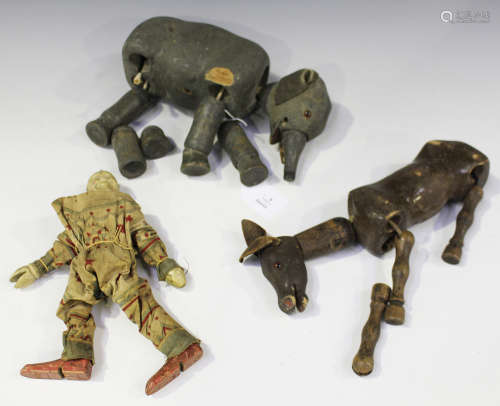 Three Schoenhut circus figures, comprising clown, elephant and mule (playwear and faults).Buyer’s