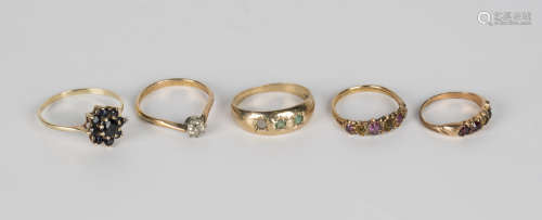A 9ct gold and sapphire cluster ring, a 9ct gold and gem set ring, a gold and gem set ring and two