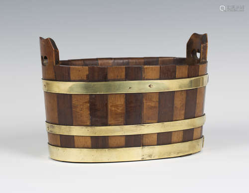 A 19th century Scottish coopered oval two-handled basket, the three horizontal brass bands