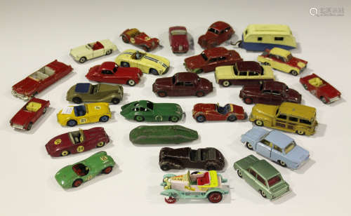 A collection of Dinky Toys cars, including a No. 157 Jaguar, finished in red with spun hubs, a No.