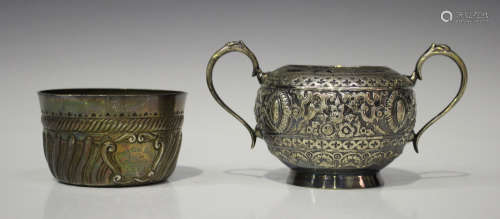 A Victorian silver two-handled sugar bowl, embossed with medallions and scroll decoration, London
