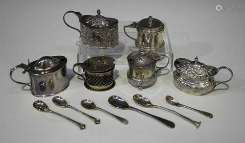 A late Victorian silver oval mustard, decorated in relief with flowers and 'C' scrolls, Birmingham