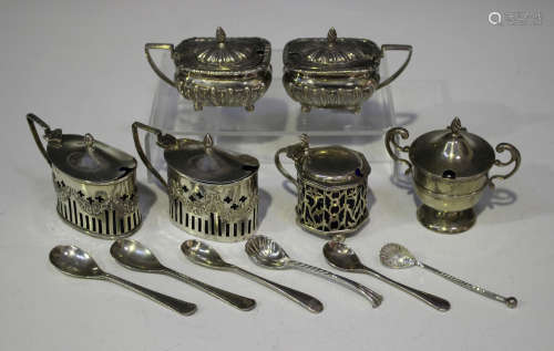 A matched pair of silver cushion shaped mustards with half-reeded decoration, Birmingham 1898 and