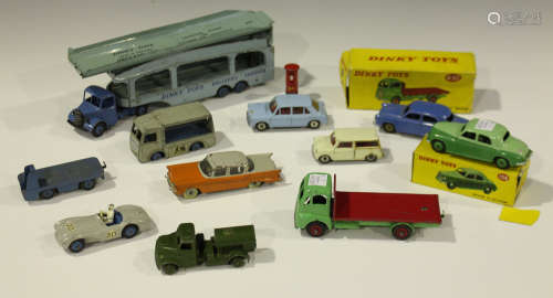 A small collection of Dinky Toys cars, commercial vehicles and accessories, including a No. 432