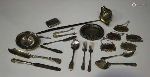 A small group of silver items, including a George III toddy ladle with twin pouring lips, fitted
