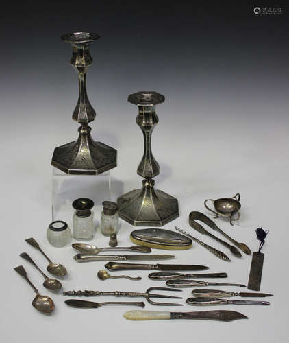 A pair of Elkington & Co Ltd plated candlesticks, each of octagonal form with baluster stem and