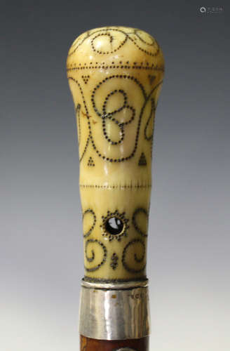 An 18th century ivory handled Malacca walking cane, the handle piqué inlaid with stylized tulips and