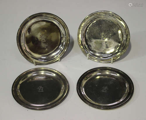 A pair of George IV silver circular dishes, each engraved with a rampant lion, London 1823 by R. &