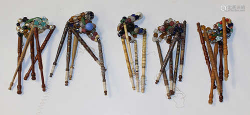 A collection of 19th century and later lacework bobbins, including four turned bone examples and