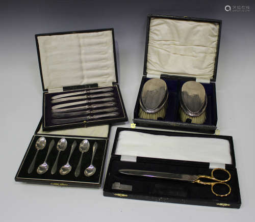 A set of six George VI silver coffee spoons, Sheffield 1942, cased, a pair of silver backed