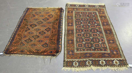 A Beluche rug, Afghan/Persian borders, early 20th century, the compartmentalized aubergine field