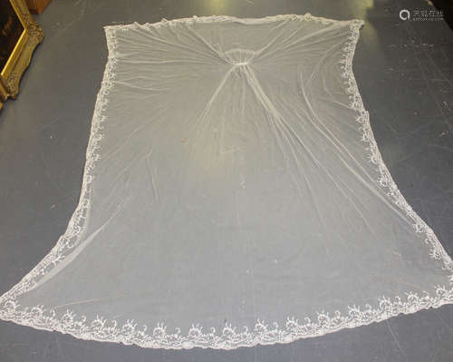 A 20th century tambour lace rectangular veil, the edge worked with foliate scrolls, 220cm x 172cm,