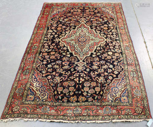 A Jozan rug, North-west Persia, mid-20th century, the charcoal field with a shaped medallion,