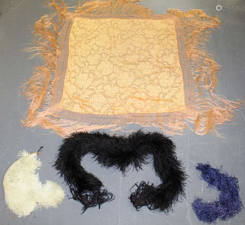 An early 20th century apricot silk and cut velour shawl and a similar black shawl, both with long