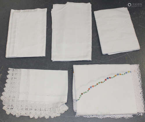 A group of whitework, including linen and damask tablecloths and a lacework frieze.Buyer’s Premium