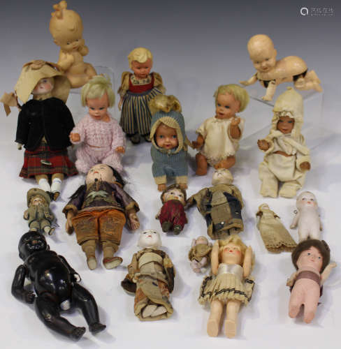 A collection of dolls, including a Parian head doll with painted moulded features and cloth body