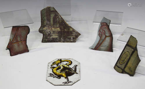 A group of four Medieval stained glass fragments, including one depicting architectural elements,