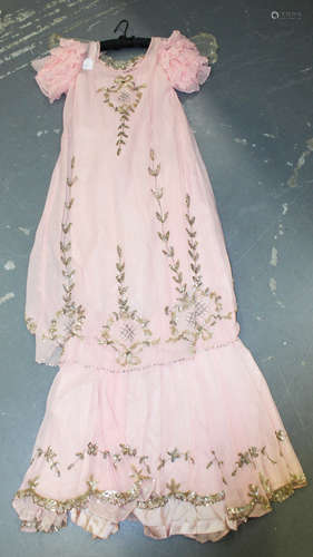 An early 20th century pink Georgette dress with lacework and sequin appliqué, length 152cm.Buyer’s