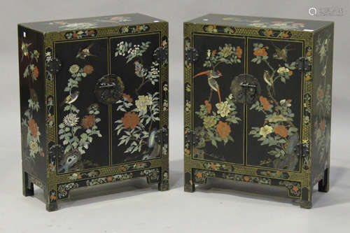 A pair of 20th century black lacquered chinoiserie side cabinets, each painted with birds and