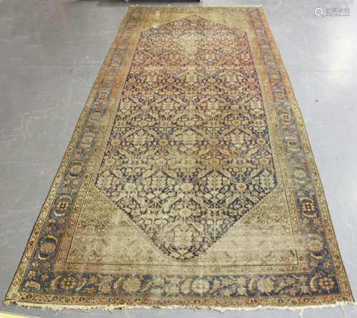 A Faraghan wide gallery runner, North-west Persia, early 20th century, the midnight blue field