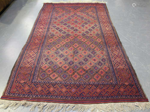 An Afghan Beluche soumak rug, early/mid-20th century, the field with overall offset hooked guls,