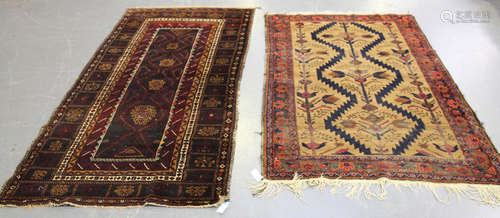 A Beluche rug, Afghan/Persian borders, late 20th century, the charcoal field with hooked medallions,