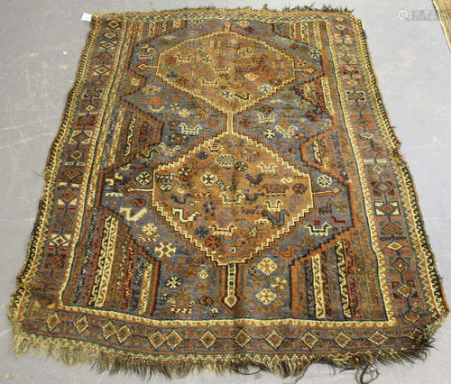 A Shiraz rug, South-west Persia, early 20th century, the blue field with two linked and stepped