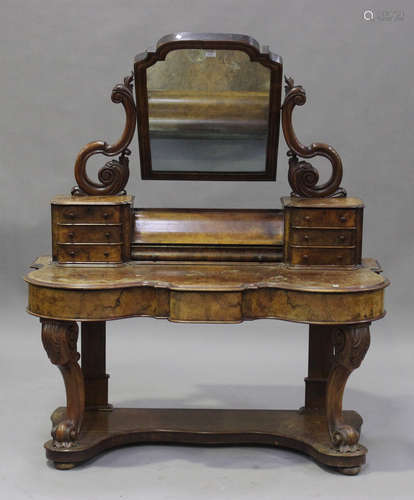 A Victorian burr walnut Duchess dressing table, fitted with a swing mirror above a hinged