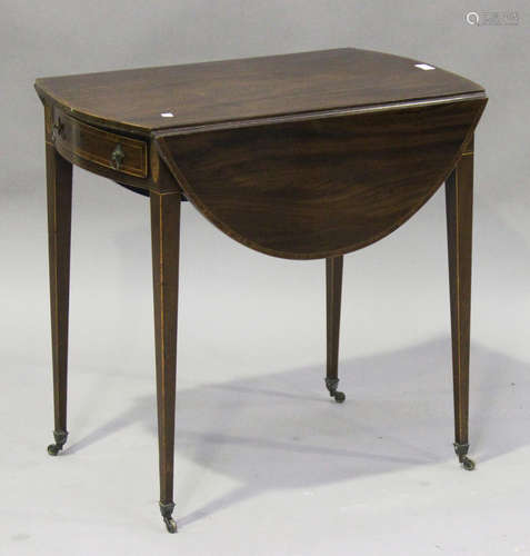 An early 19th century mahogany oval Pembroke table with crossbanded and line inlaid decoration,