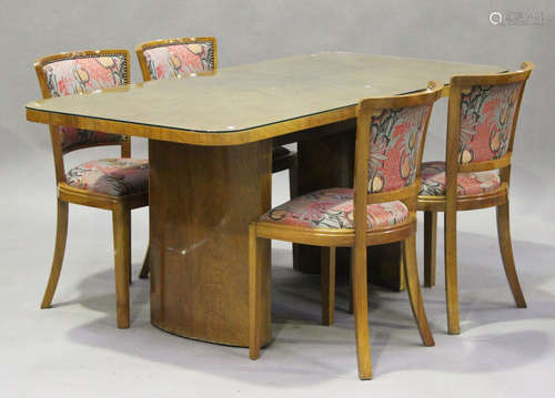 An Art Deco walnut dining room suite by Heals, comprising a sideboard, height 90cm, width 130cm,