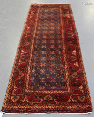 A Hamadan runner, North-west Persia, mid-20th century, the blue field with a flowerhead lattice,