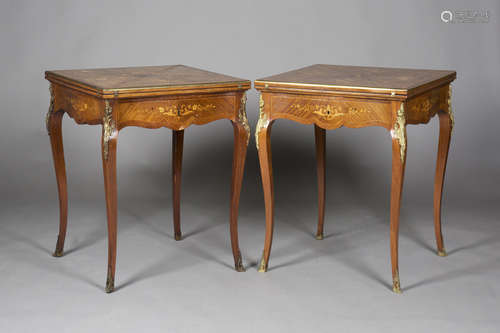 A pair of late-Victorian kingwood and foliate inlaid envelope card tables with gilt metal mounts,