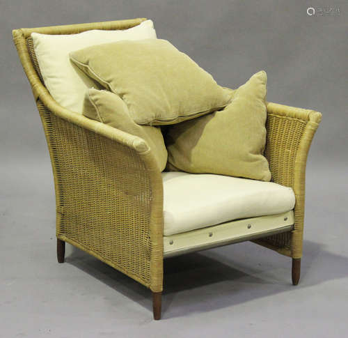 A late 20th century wicker covered armchair, possibly retailed by the Conran Shop, together with