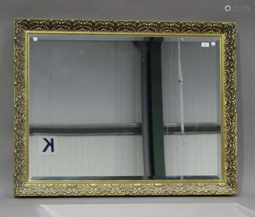 A modern gilt composition framed rectangular wall mirror, 90cm x 115cm.Buyer’s Premium 29.4% (