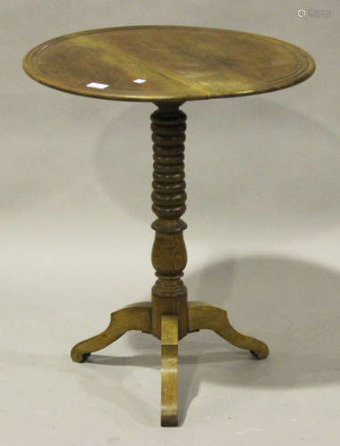 A 19th century mahogany circular wine table, the turned column on tripod legs, height 71cm, diameter