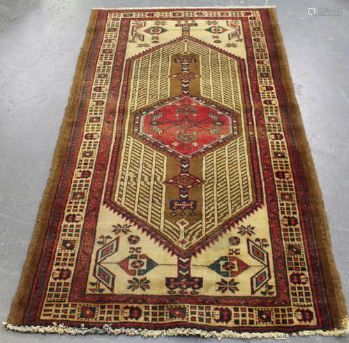 A Sarab rug, North-west Persia, early/mid-20th century, the ivory field with an angular reserve