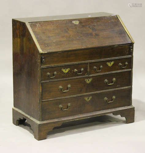 A George III walnut bureau, the fall front above two short and two long drawers, on bracket feet,