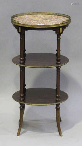 A fine late 19th/early 20th century French mahogany three-tier étagère, the gilt metal galleried top