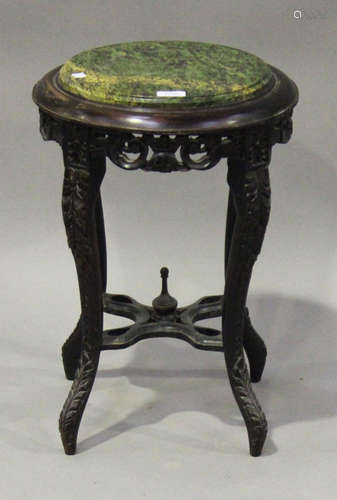 A 20th century French stained beech jardinière stand, the faux-marble top raised on carved