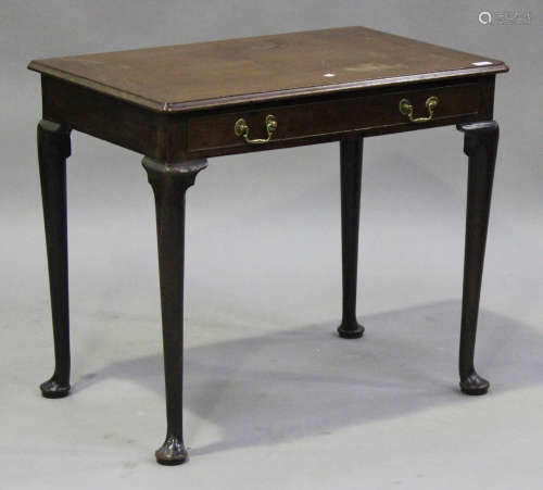 A George II mahogany side table, the moulded top above a single frieze drawer, raised on cabriole