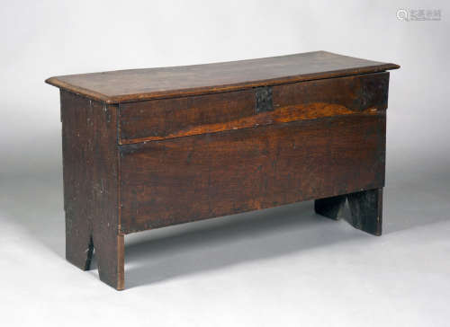 An unusual George II oak boarded coffer, the hinged lid indistinctly incised with a name and dated