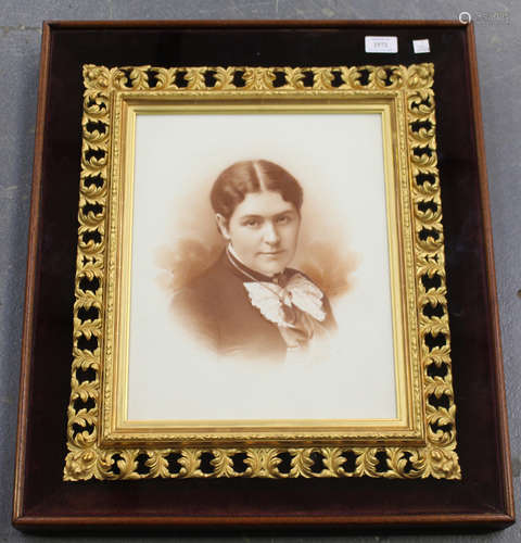 A late Victorian opal type photograph portrait, mounted within a giltwood frame and glazed case,