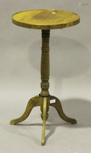 An early 20th century French beech and cherry circular wine table, the turned column on tripod legs,