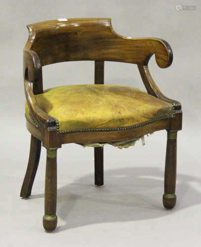 A French Empire mahogany tub back and scroll arm desk chair, the seat overstuffed and upholstered in