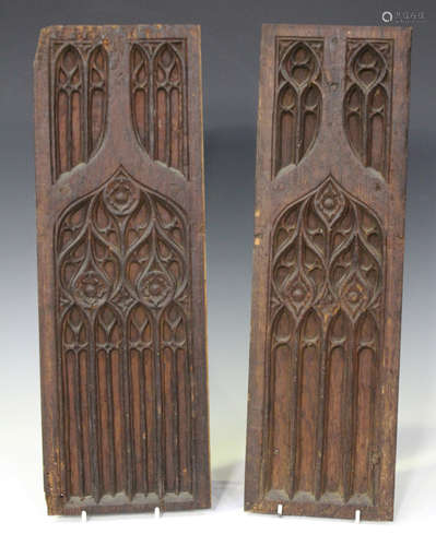 Two similar Gothic carved oak tracery panels, English 14th-15th century, 52cm x 17.8cm and 52cm x