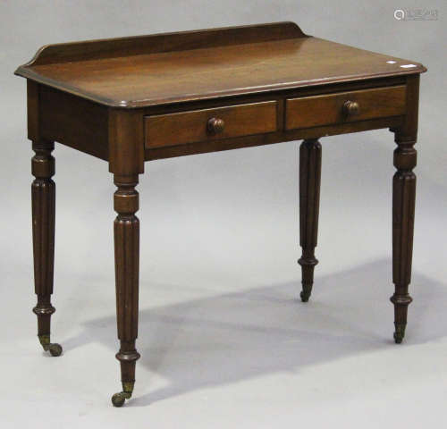 An early Victorian mahogany side table, fitted with two frieze drawers, raised on turned and